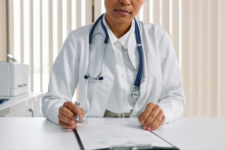 Physician reviewing paperwork while planning a new medical practice