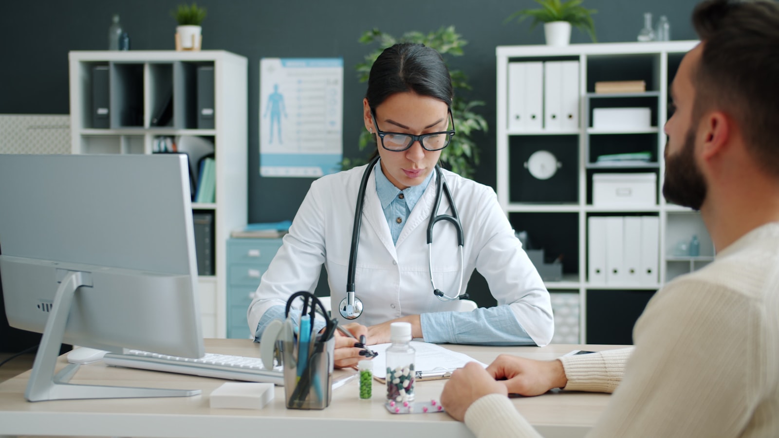 Physician seeing a patient, the visit capacity that limits how fast you can grow a medical practice