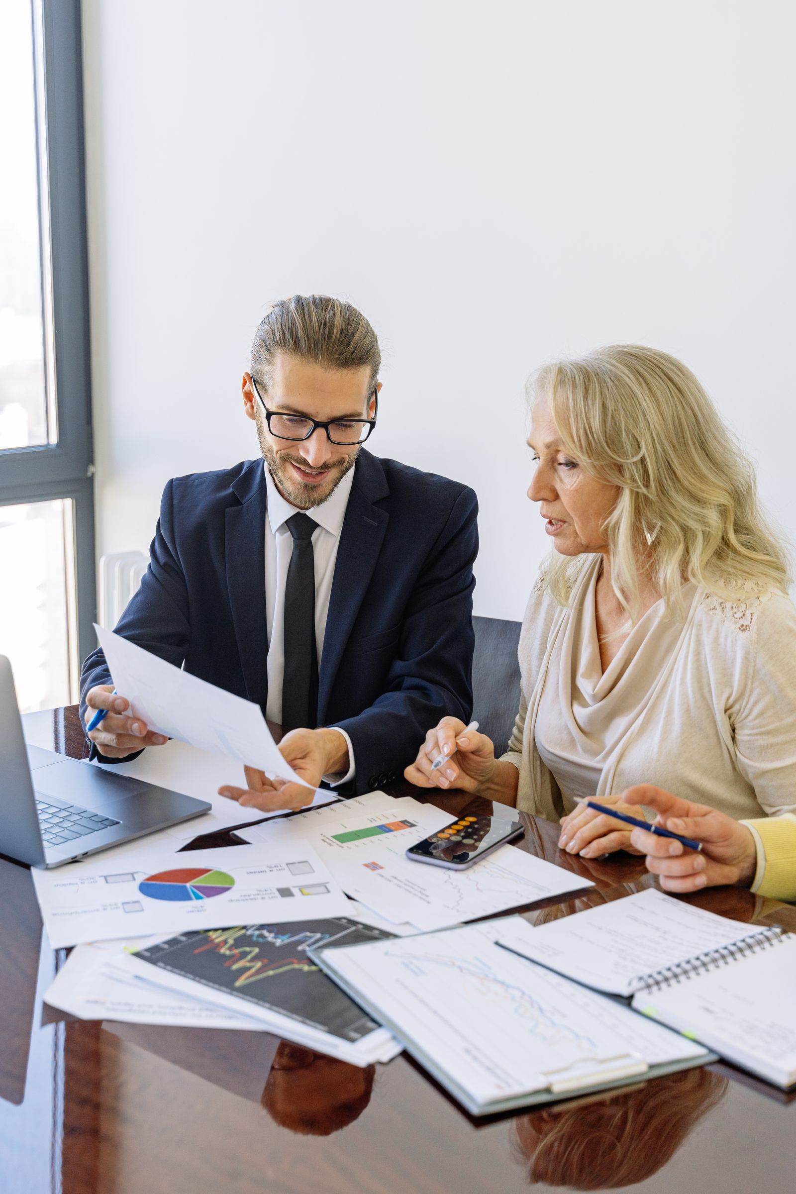 Medical practice management consultant reviewing practice financial performance and KPIs