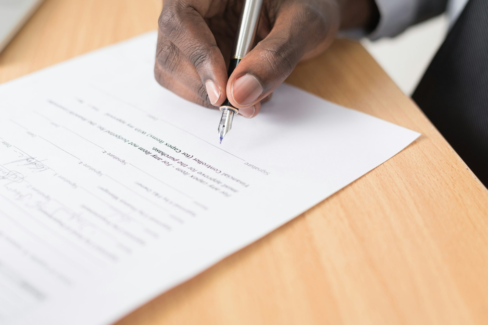 Physician reviewing Stark Law compliance and financial relationship documents at a medical practice