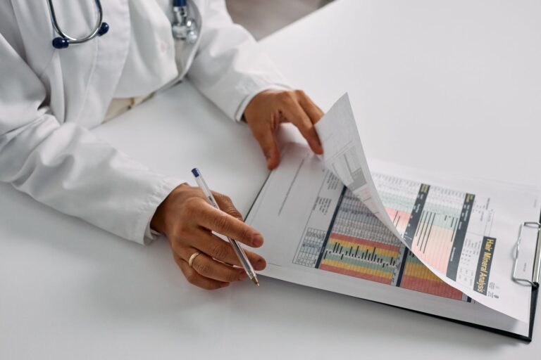 Clinician performing a medical coding audit by reviewing chart documentation against the billed codes